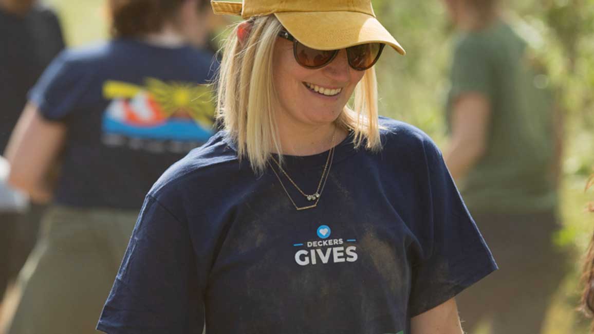 woman volunteering in Deckers Gives shirt